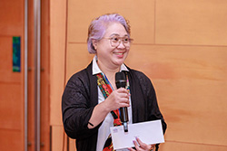 Restituta Tan speaking at congress in 2024